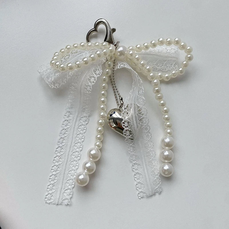 Noelie coquette ribbon x pearl bag charm