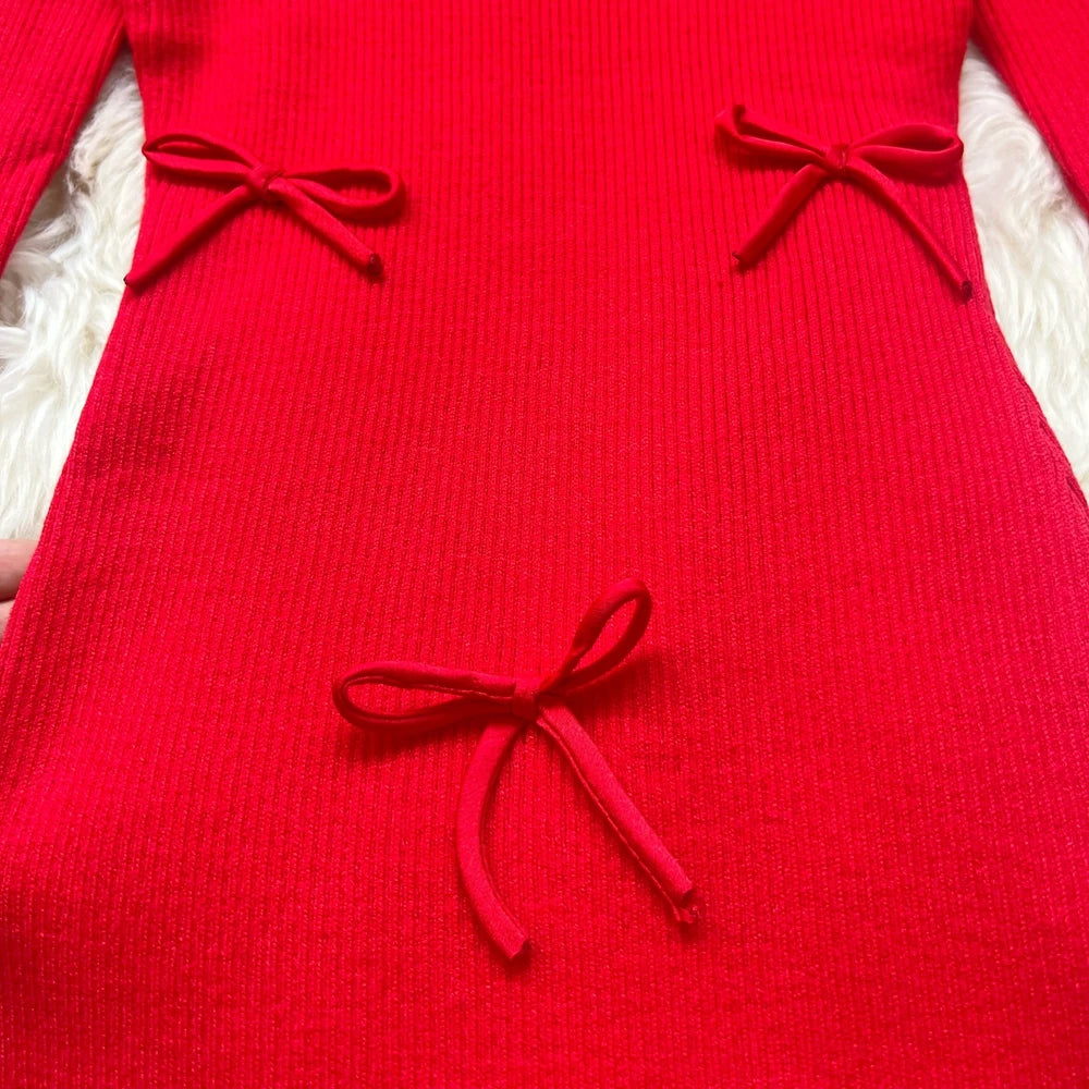 Sorelle Women's knitted ruffle hem dress with bow accents