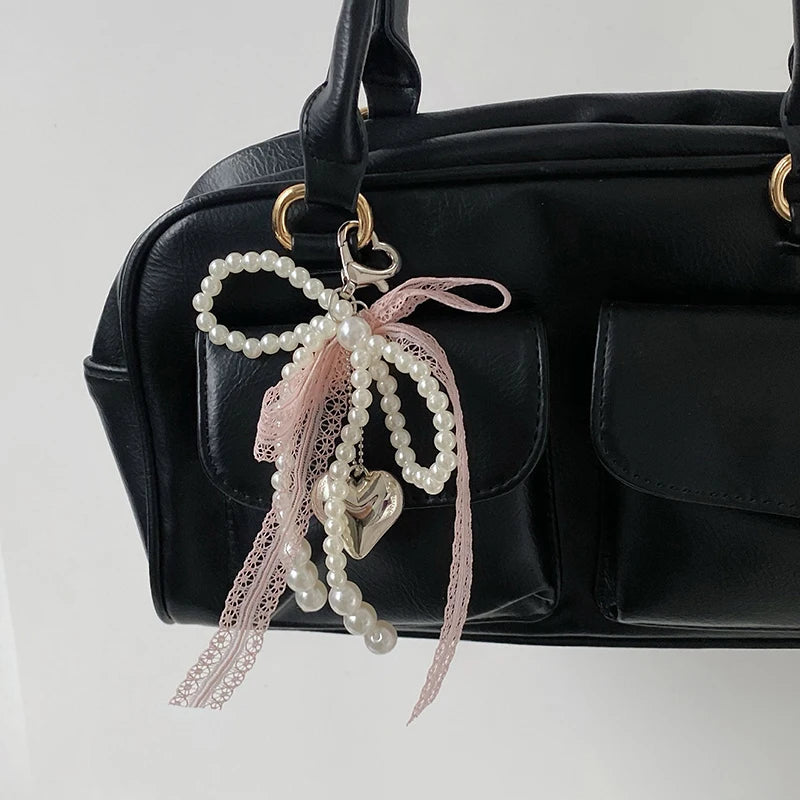 Noelie coquette ribbon x pearl bag charm