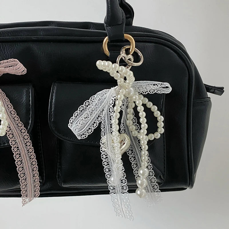 Noelie coquette ribbon x pearl bag charm