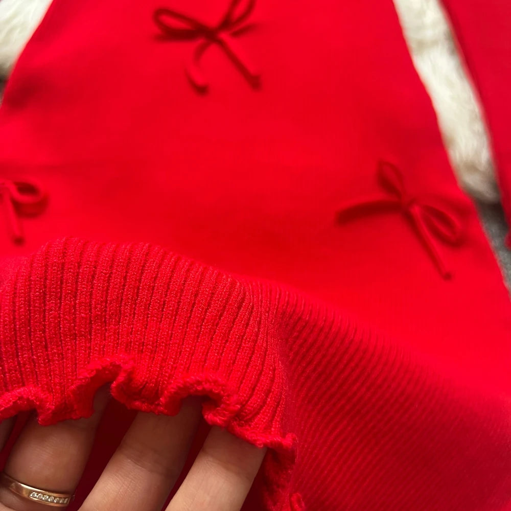 Sorelle Women's knitted ruffle hem dress with bow accents