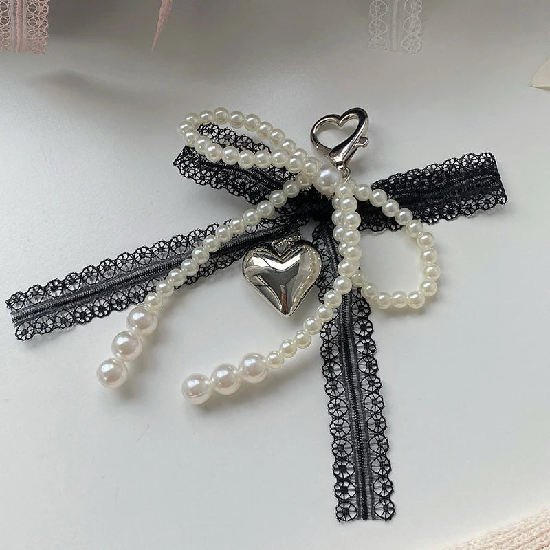 Noelie coquette ribbon x pearl bag charm